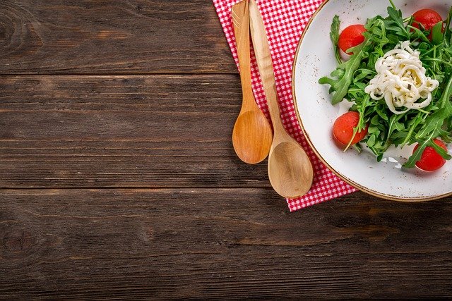 a Nutrition salad with tomatoes and cheese in a bowl