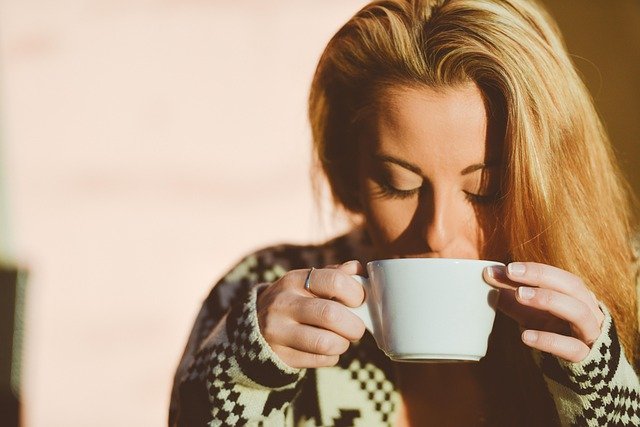 a woman drinking something for hydration
